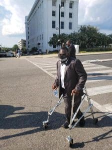 a man standing in a parking lot a man standing in a parking lot