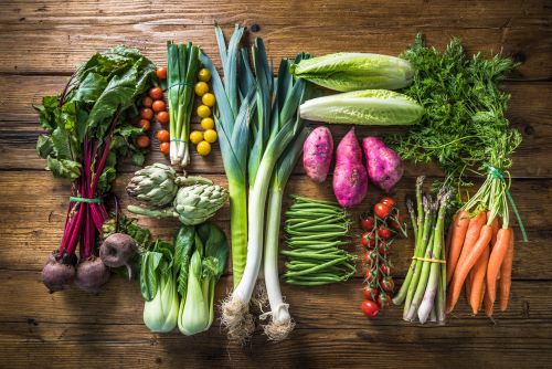 A Variety Of Vegetables On A Wooden Surface