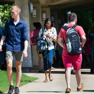 a group of people walking down the street