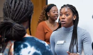 a man and a woman looking at the camera