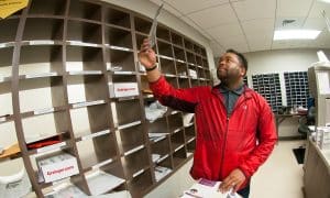 Chris Kelley sorts through mail.