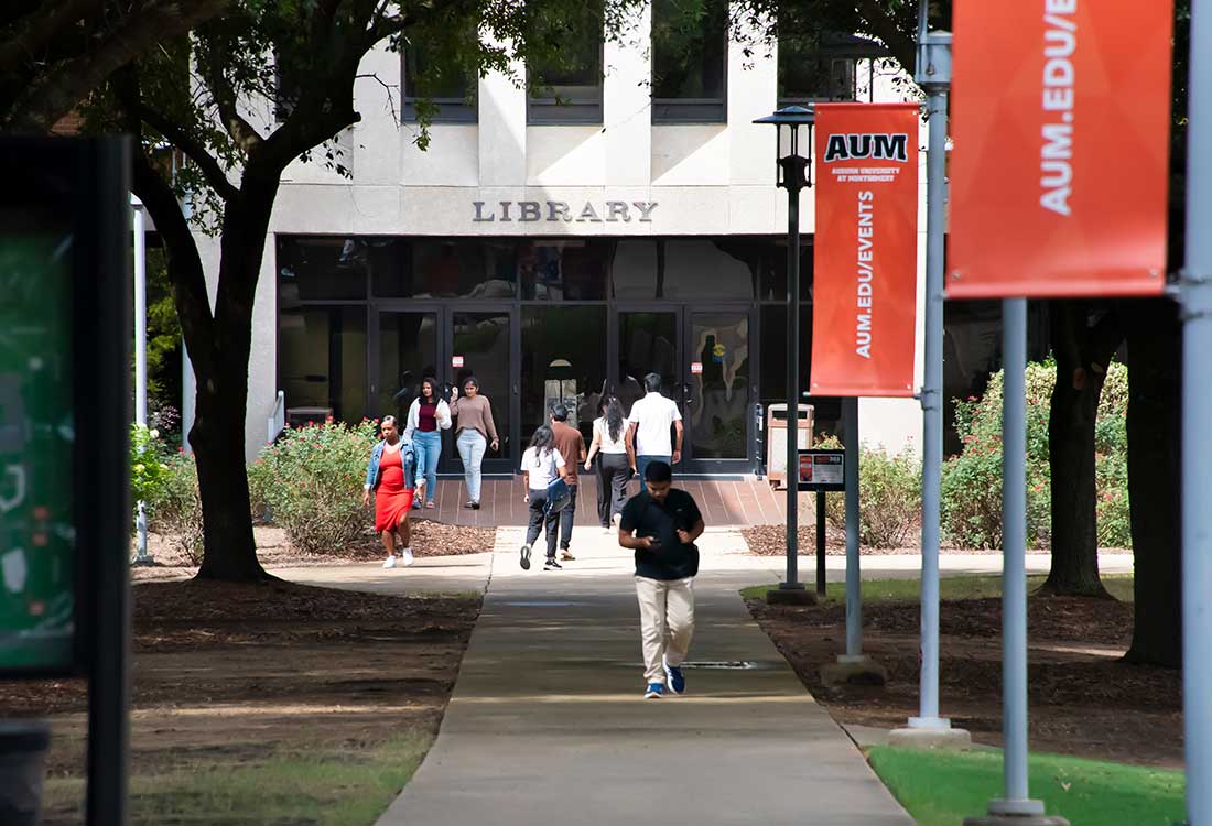 Students walking around AUM campus
