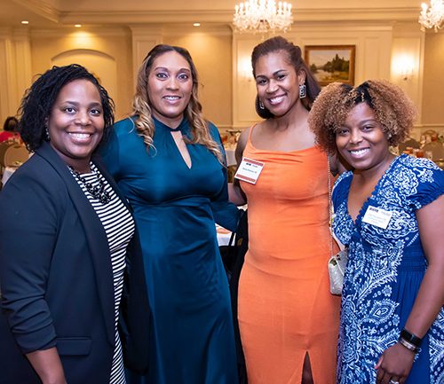 A Couple Of People Posing For The Camera