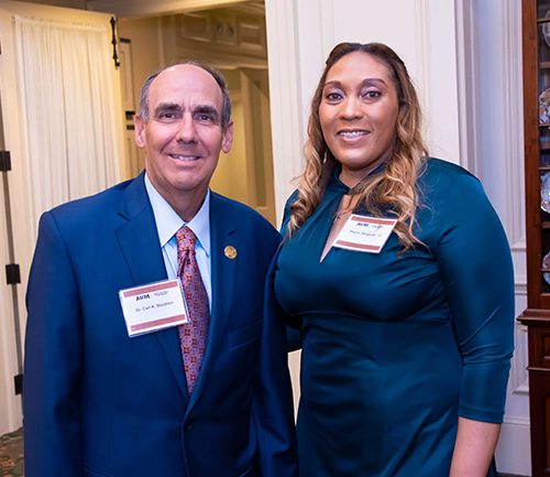 A Man And A Woman Posing For A Picture