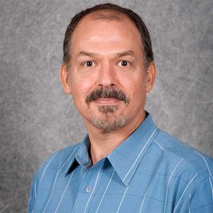 a man wearing a blue shirt