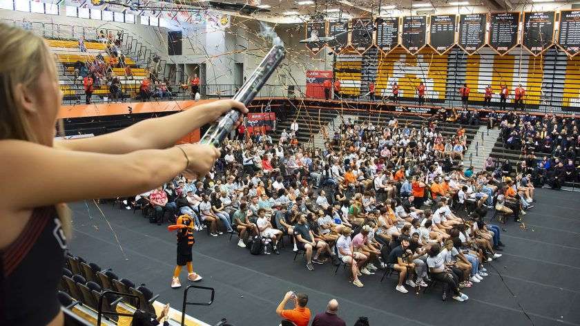 A Cheerleader Fires A Confetti Cannon At AUM's New Student Convocation