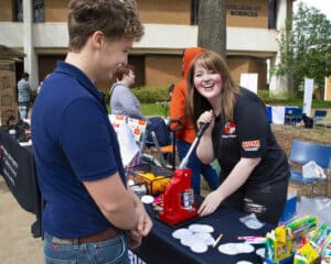 a man and a woman standing in front of a building