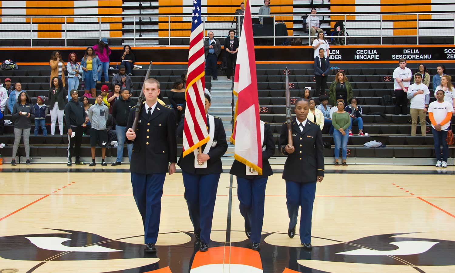 ROTC student present the flags during Military Appreciation Night.
