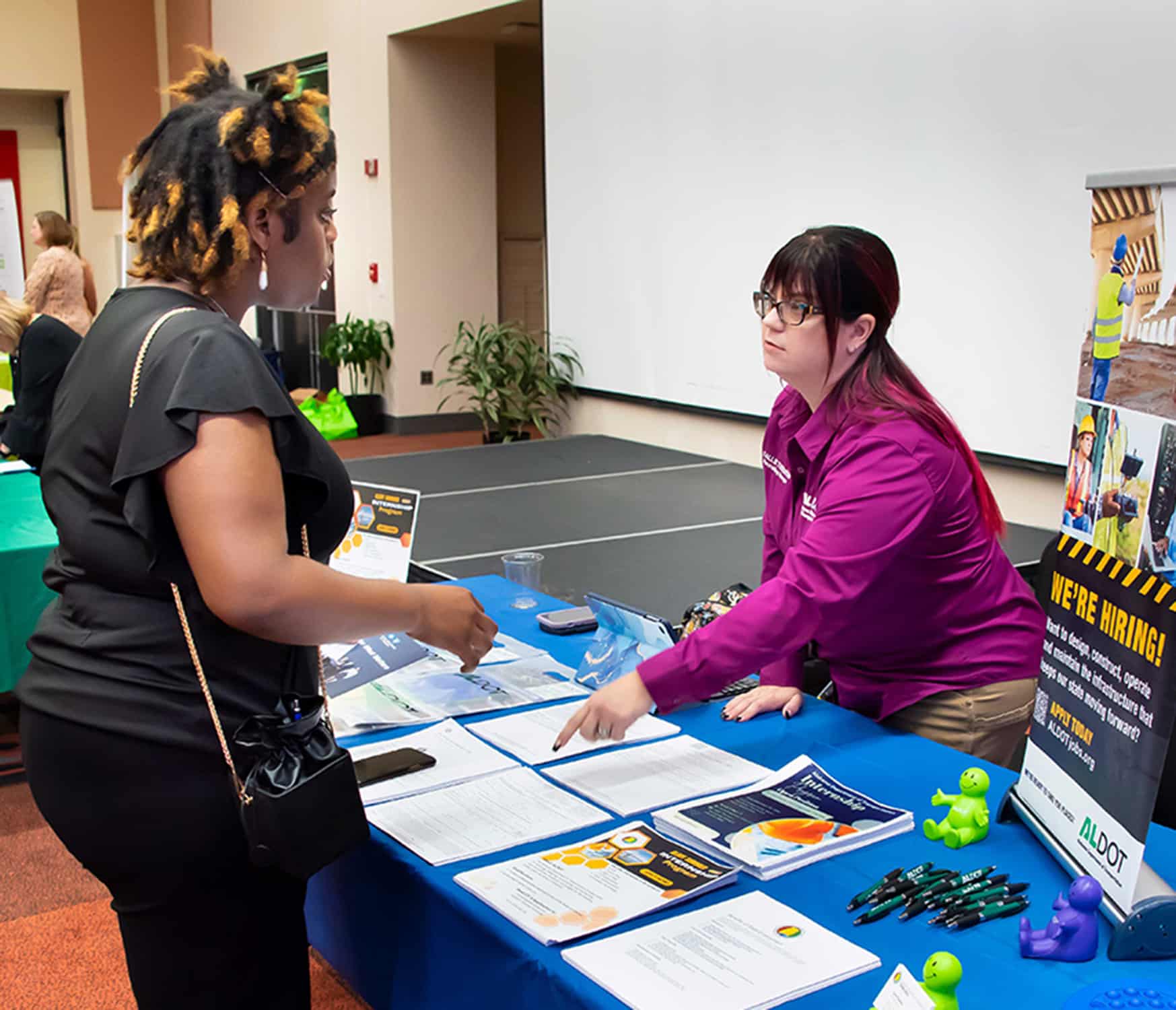 Ellen Burr sitting at a table