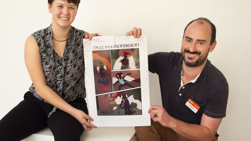 Montgomery Area High School Student Harmony Koda (left) Holds Up A Printed Piece Of Artwork While Auburn University At Montgomery Department Of Fine Arts Chair William Fenn Kneeling To The Right.