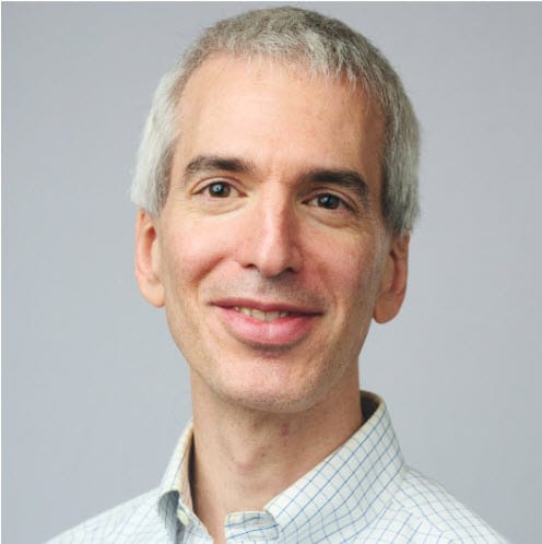 Jeremy Caplan wearing glasses and smiling at the camera