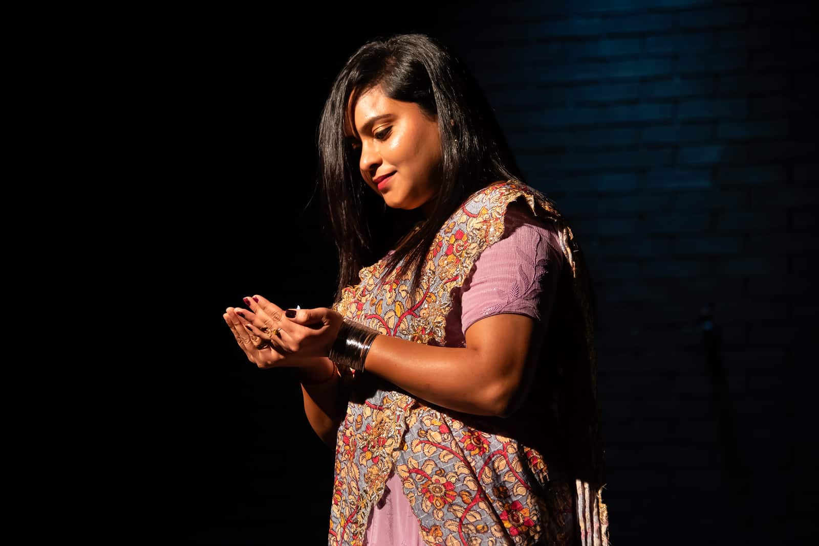 A student presents at the Diwali celebration.