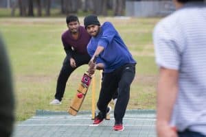 Students play cricket in celebration of International Education Week.