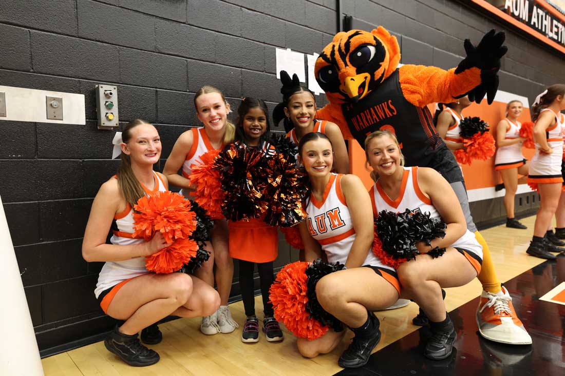 a group of people posing for the camera