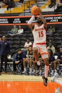 Talib Ferrette jumps to make a two-point shot.