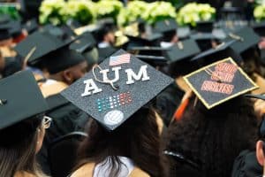 Students decorate their caps for commencement.