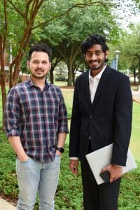 Tathagata Bhattacharya and Harshavardhan Meka stand together on campus.