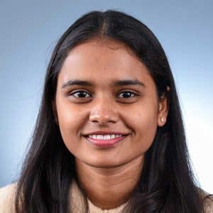 a close up of a woman who is smiling at the camera