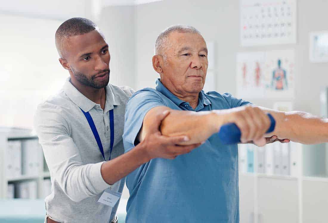 A person helping another person with strength recovery