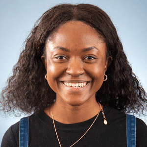 A smiling woman wearing a black top and gold necklace, Auburn University at Montgomery.