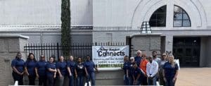 Volunteers stand outside at River Region Connects.
