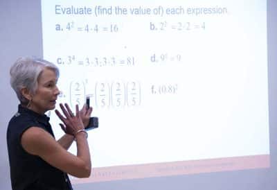A woman teaching a math lesson on evaluating expressions at Auburn University at Montgomery.