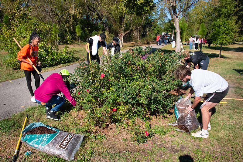 Students at Auburn University at Montgomery participate in a community clean-up project at Shady Street.