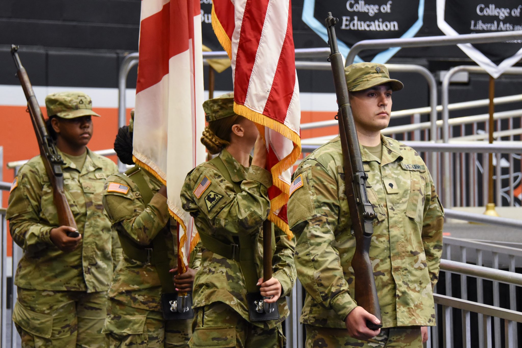 Auburn University at Montgomery ROTC color guard presents U.S. and Alabama flags at commencement.