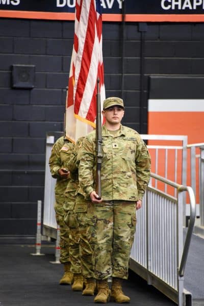 Auburn University at Montgomery ROTC color guard presents the U.S. flag at a commencement ceremony.