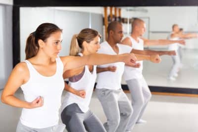 People practice punching in a self-defense training course.
