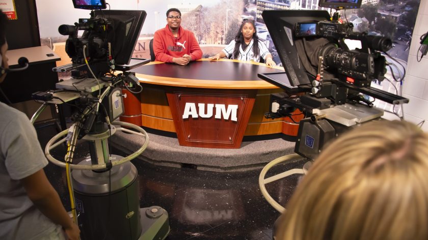 Auburn University At Montgomery Students Host A Broadcast At The AUM News Desk With Studio Cameras During Media Production