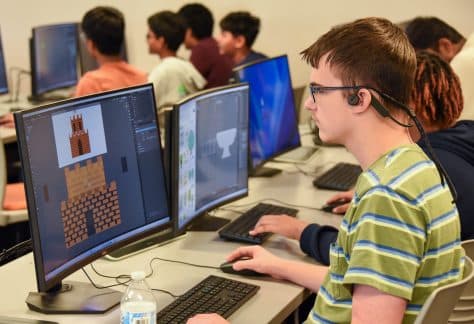 Auburn University at Montgomery student creates pixel art game assets in a computer lab during AUM game design class.